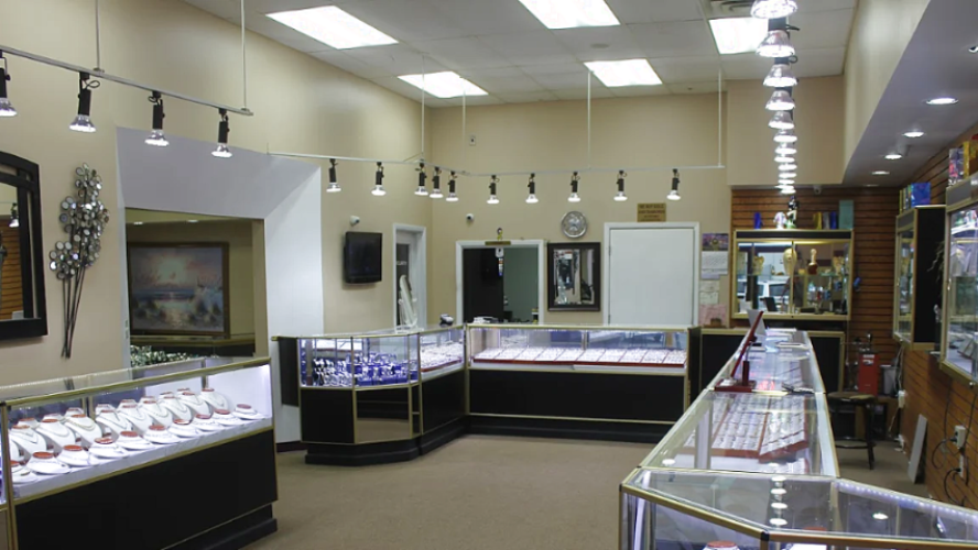 Jewelry store interior with display cases and mirrors.